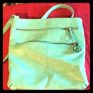 teal blue bag has pockets & zippers & straps oh my